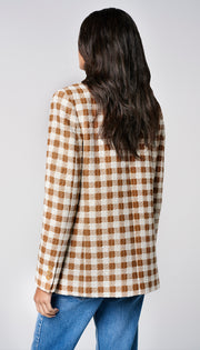 Woman in checkered blazer